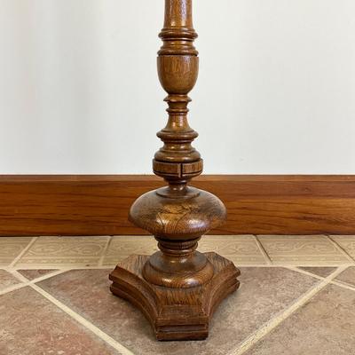 Sale Photo Thumbnail #850: Has two areas of damage on top, and one chip on lower stem, refer to photos
Made of oakwood
Measures: 33" high x 9" wide base x 5.5" diameter top