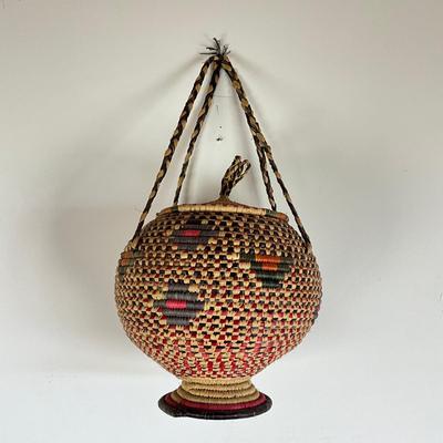 Sale Photo Thumbnail #941: From Kwazulu-Natal Sooth Africa "UKHAMBA Basket"
Measures: 10" high x 10" diameter x 18" high with handle