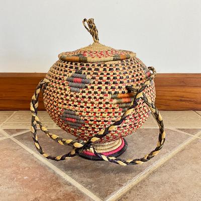 Sale Photo Thumbnail #945: From Kwazulu-Natal Sooth Africa "UKHAMBA Basket"
Measures: 10" high x 10" diameter x 18" high with handle