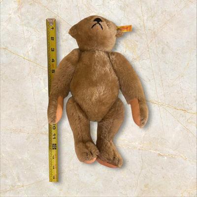 Sale Photo Thumbnail #1369: Steiff Teddy Bear West Germany 14" Long, Wool and Cotton, excellent condition but for a little smudge of dirt on back of head as shown in photo