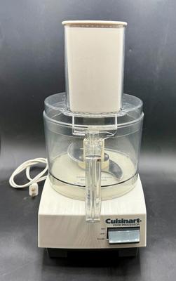 Sale Photo Thumbnail #393: Model DLC-5, capacity of 7 cups. Includes: Work bowl with handle, work bowl cover, with large feed tube and pusher, stainless steel chopping blade, medium shredding disc, and standard slicing disc.  Tested, works as expected.
