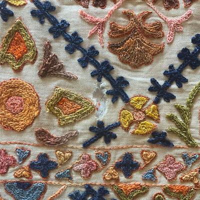 Sale Photo Thumbnail #1147: Has a few holes due to age ( refer to photos)
Intricate embroidery with pink, orange, green, blue and brown colors
Measures: 62" wide x 98" long