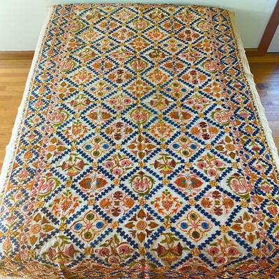 Sale Photo Thumbnail #1149: Has a few holes due to age ( refer to photos)
Intricate embroidery with pink, orange, green, blue and brown colors
Measures: 62" wide x 98" long