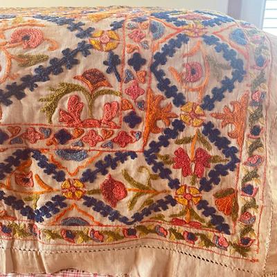 Sale Photo Thumbnail #1148: Has a few holes due to age ( refer to photos)
Intricate embroidery with pink, orange, green, blue and brown colors
Measures: 62" wide x 98" long
