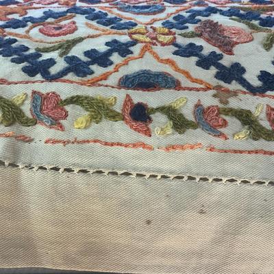 Sale Photo Thumbnail #1145: Has a few holes due to age ( refer to photos)
Intricate embroidery with pink, orange, green, blue and brown colors
Measures: 62" wide x 98" long
