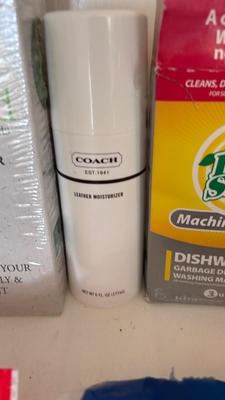 A BUCKET AND AN ARRAY OF DIFFERENT CLEANING PRODUCTS