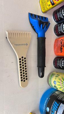 A BUCKET AND AN ARRAY OF DIFFERENT CLEANING PRODUCTS