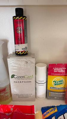 A BUCKET AND AN ARRAY OF DIFFERENT CLEANING PRODUCTS