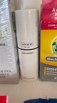 A BUCKET AND AN ARRAY OF DIFFERENT CLEANING PRODUCTS