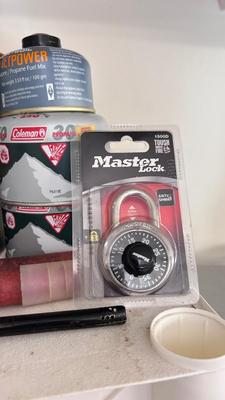 A JETBOIL ALONG WITH BUG AND BEAR REPELLENT, MATCHES, A VARIETY OF DIFFERENT ROPE AND MORE