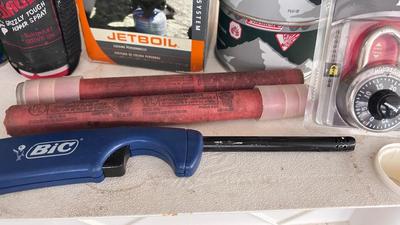 A JETBOIL ALONG WITH BUG AND BEAR REPELLENT, MATCHES, A VARIETY OF DIFFERENT ROPE AND MORE