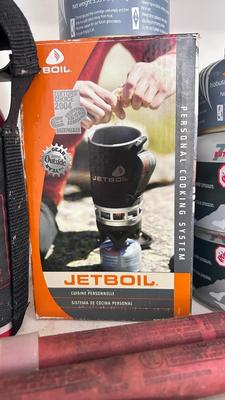 A JETBOIL ALONG WITH BUG AND BEAR REPELLENT, MATCHES, A VARIETY OF DIFFERENT ROPE AND MORE