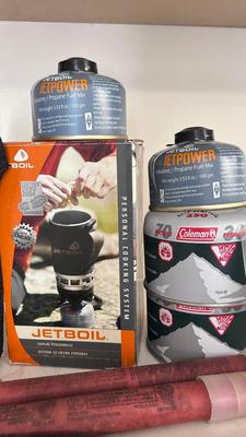 A JETBOIL ALONG WITH BUG AND BEAR REPELLENT, MATCHES, A VARIETY OF DIFFERENT ROPE AND MORE