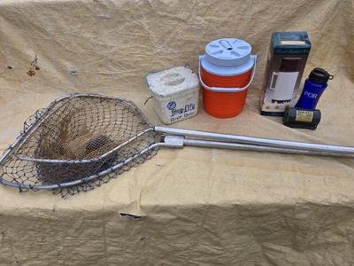 Two long, large fish nets - bob bet bait box- thermos, and a water bottle