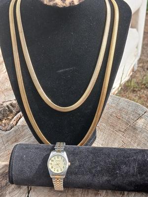 Two gold toned thick chain necklaces with a Watch - it watch