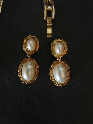 Two gold tone necklaces a pair of earrings and a vintage Victoria Rhein quartz watch