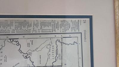 64/100 BARBARA MOORE FRAMED ARTWORK AND 1979 FRAMED COMMERCIAL ATLAS MAP OF COLORFUL COLORADO