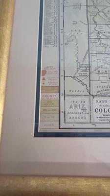 64/100 BARBARA MOORE FRAMED ARTWORK AND 1979 FRAMED COMMERCIAL ATLAS MAP OF COLORFUL COLORADO