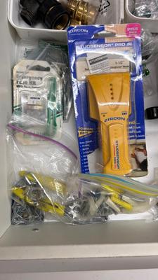DRAWER PACKED WITH A VARIETY OF DIFFERENT HARDWARE