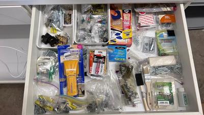 DRAWER PACKED WITH A VARIETY OF DIFFERENT HARDWARE