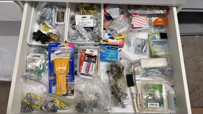 DRAWER PACKED WITH A VARIETY OF DIFFERENT HARDWARE