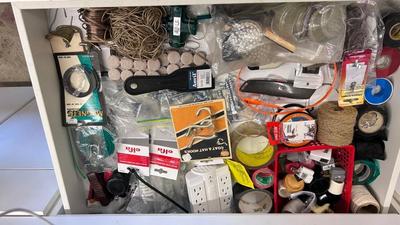 ANOTHER DRAWER PACKED WITH ALL SORTS OF HARDWARE AND HOUSEHOLD NEEDS