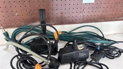 AN ASSORTMENT OF DIFFERENT PUMPS FOR PONDS AND AN OUTDOOR EXTENSION CORD