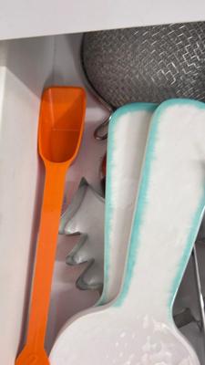 CUTCO KNIVES, A PORCELAIN JUICER, COOKIE CUTTERS AND OTHER HANDY UTENSILS
