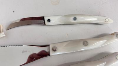 CUTCO KNIVES, A PORCELAIN JUICER, COOKIE CUTTERS AND OTHER HANDY UTENSILS