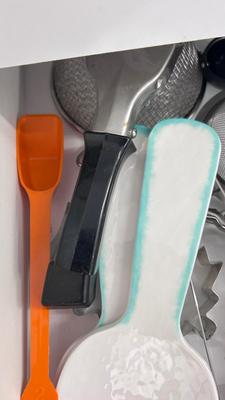 CUTCO KNIVES, A PORCELAIN JUICER, COOKIE CUTTERS AND OTHER HANDY UTENSILS