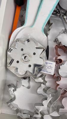 CUTCO KNIVES, A PORCELAIN JUICER, COOKIE CUTTERS AND OTHER HANDY UTENSILS