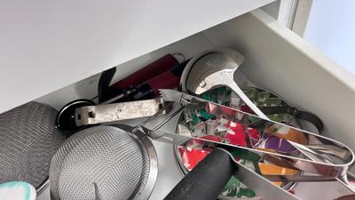 CUTCO KNIVES, A PORCELAIN JUICER, COOKIE CUTTERS AND OTHER HANDY UTENSILS
