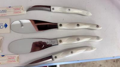 CUTCO KNIVES, A PORCELAIN JUICER, COOKIE CUTTERS AND OTHER HANDY UTENSILS