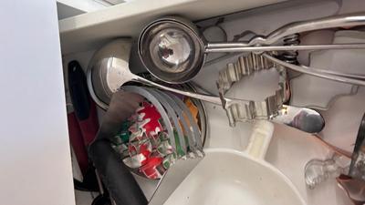 CUTCO KNIVES, A PORCELAIN JUICER, COOKIE CUTTERS AND OTHER HANDY UTENSILS