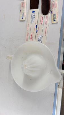 CUTCO KNIVES, A PORCELAIN JUICER, COOKIE CUTTERS AND OTHER HANDY UTENSILS