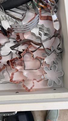 CUTCO KNIVES, A PORCELAIN JUICER, COOKIE CUTTERS AND OTHER HANDY UTENSILS