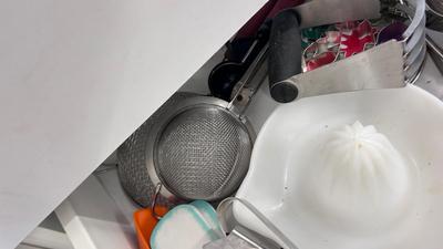 CUTCO KNIVES, A PORCELAIN JUICER, COOKIE CUTTERS AND OTHER HANDY UTENSILS