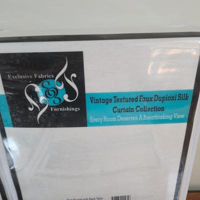 LOT 222H: New in Package Four Curtain Panels