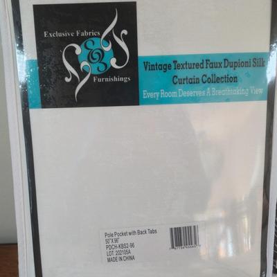 LOT 222H: New in Package Four Curtain Panels