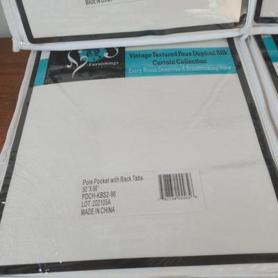 LOT 222H: New in Package Four Curtain Panels