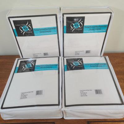 LOT 222H: New in Package Four Curtain Panels