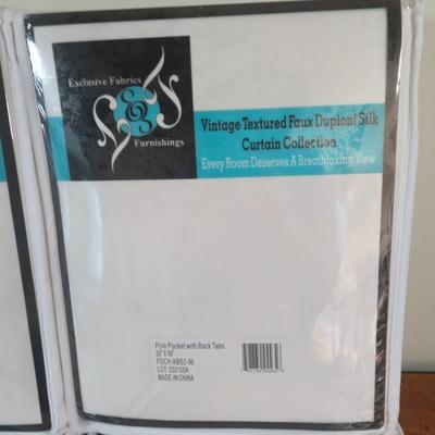 LOT 222H: New in Package Four Curtain Panels