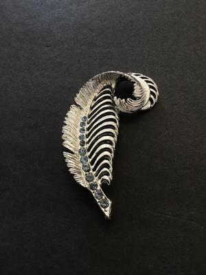 Silver tone leaf brooch with light blue rhinestones