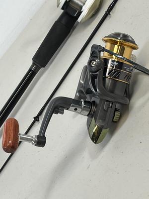 LOT 75: Fishing Rod with Okuma Stratus V Baitcaster Reel + Additional Reel