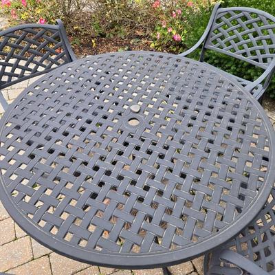 Lot 281: Metal Outdoor Table with Four Swivel Chairs and Umbrella Base