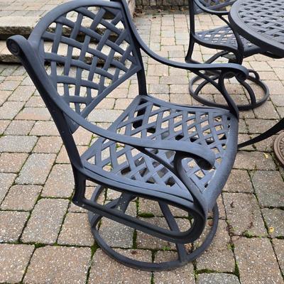 Lot 281: Metal Outdoor Table with Four Swivel Chairs and Umbrella Base