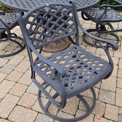 Lot 281: Metal Outdoor Table with Four Swivel Chairs and Umbrella Base