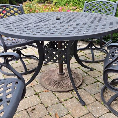 Lot 281: Metal Outdoor Table with Four Swivel Chairs and Umbrella Base