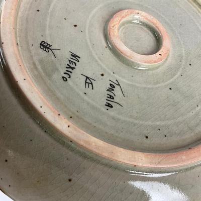Sale Photo Thumbnail #1431: Two bowls, three plates (9.5" diameter) signed Moodie, 1-handled cane/pottery edge tray (11.5" square), 1 dinner plate (11" diameter), 6 mexico pottery bird plates
Some have chipping damage