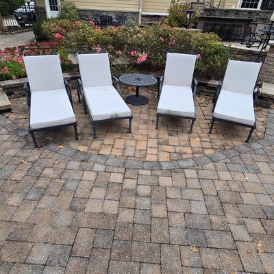 LOT 285: Four Single and One Double Metal Lounge Chairs with Cushions and Two Round Tables